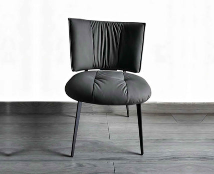 Modern Elegant Curved Back Leather Dining Chair High-End Residential Furniture With Slim Tapered Metal Legs