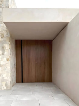 Contemporary Natural Wood Pivot Entry Door with Sleek Integrated Black Pull