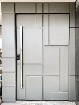 Contemporary Multi-Panel Gray Pivot Door with Long Vertical Chrome Handle