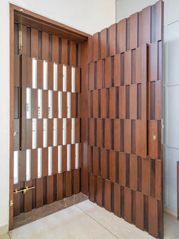 Architectural Statement Dark Timber Pivot Door Featuring Integrated Side Panels