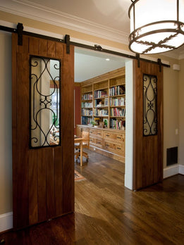 Traditional Double Interior Sliding Barn Doors with Decorative Iron Inlay